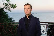 President Medvedev with the Black Sea in Sochi behind him