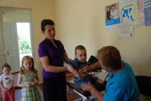 Children are being examined at the outpatient facility in Chkhuteli before immunization