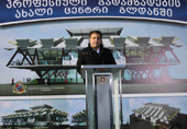 President Mikheil Saakashvili speaks to a crowd in the Tbilisi suburb of Gldani as he opens a center for professional development