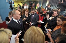 Russian President-elect Vladimir Putin speaks with reporters