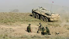 Russian soldiers operate a mortar in a past military exercise.