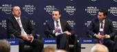 PM Garibashvili sits between the other world leaders in Davos