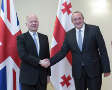 Georgian President (right) shakes hands with the British Foreign Secretary